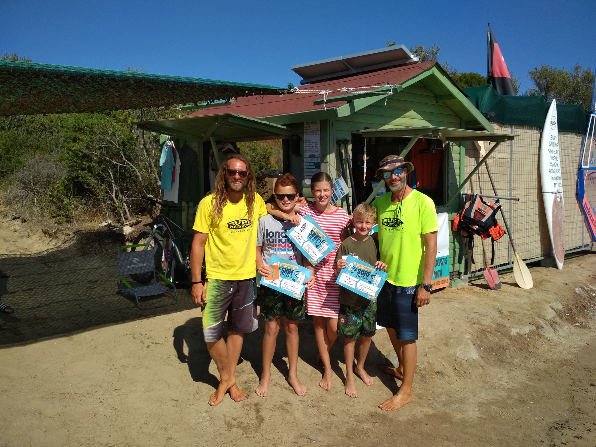 Surfing instructors and their students